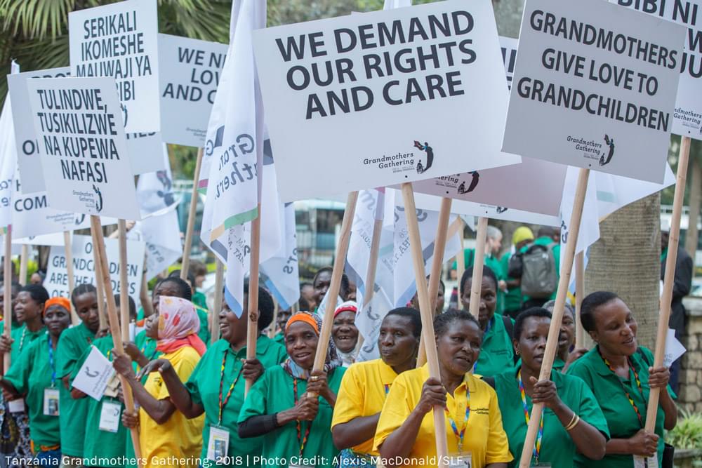 grandmothers with signs reading: we demand our rights and care
