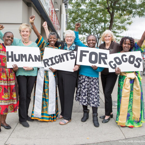 grandmothers holding signs which read human rights for gogos